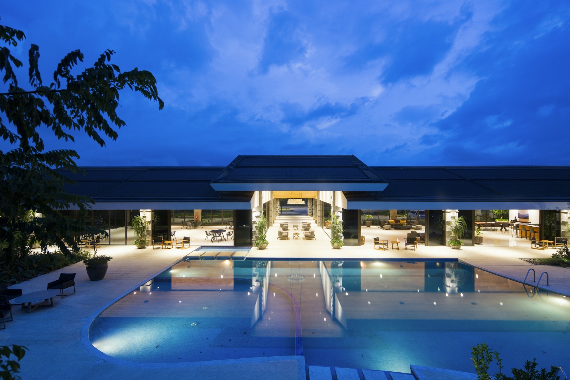 Resort pool and entrance at dusk